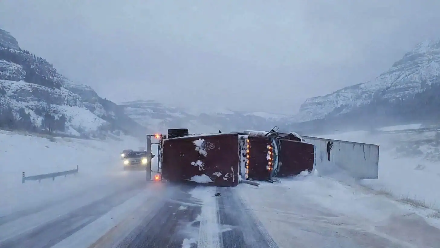 Semi truck blown over on a snowy Montana interstate in high winds